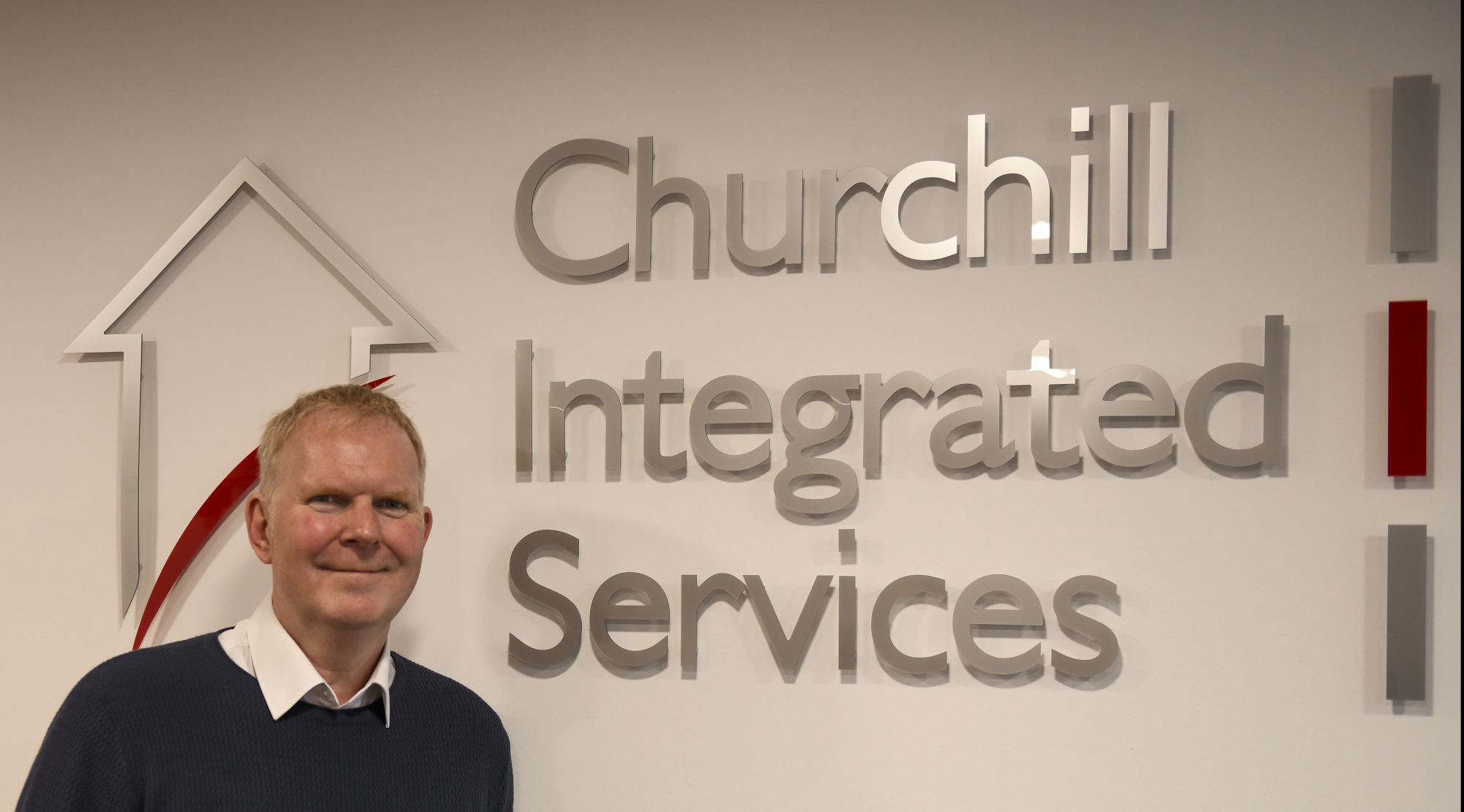 Richard Mander next to Churchill IS sign